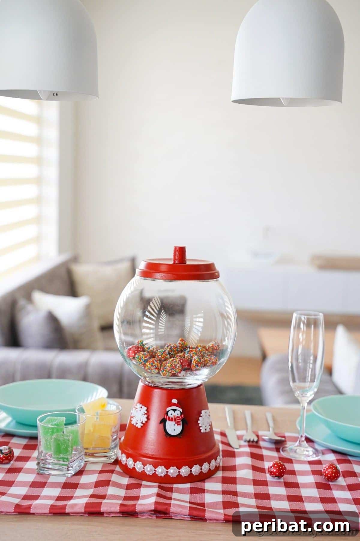 Festive Candy Dispenser on a Budget 19 red winter candy dispenser on red checked tablecloth on table