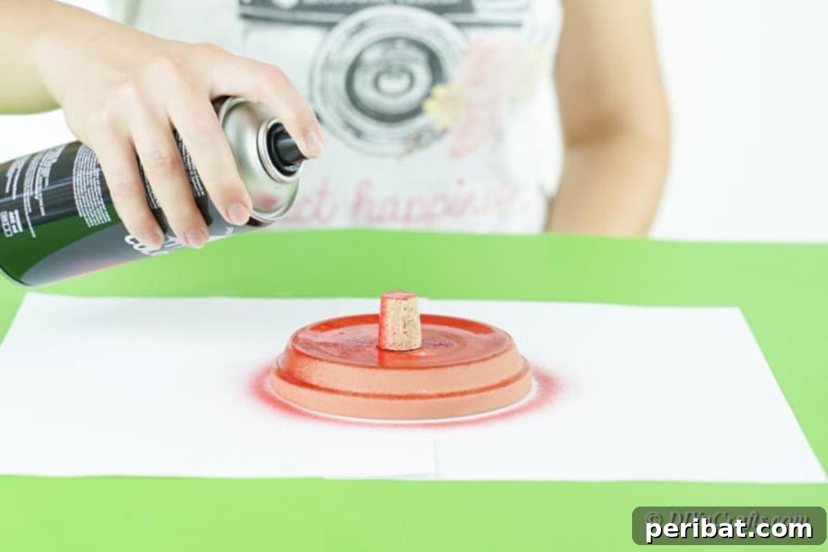 Festive Candy Dispenser on a Budget 10 spray painting clay pot bottom with cork piece