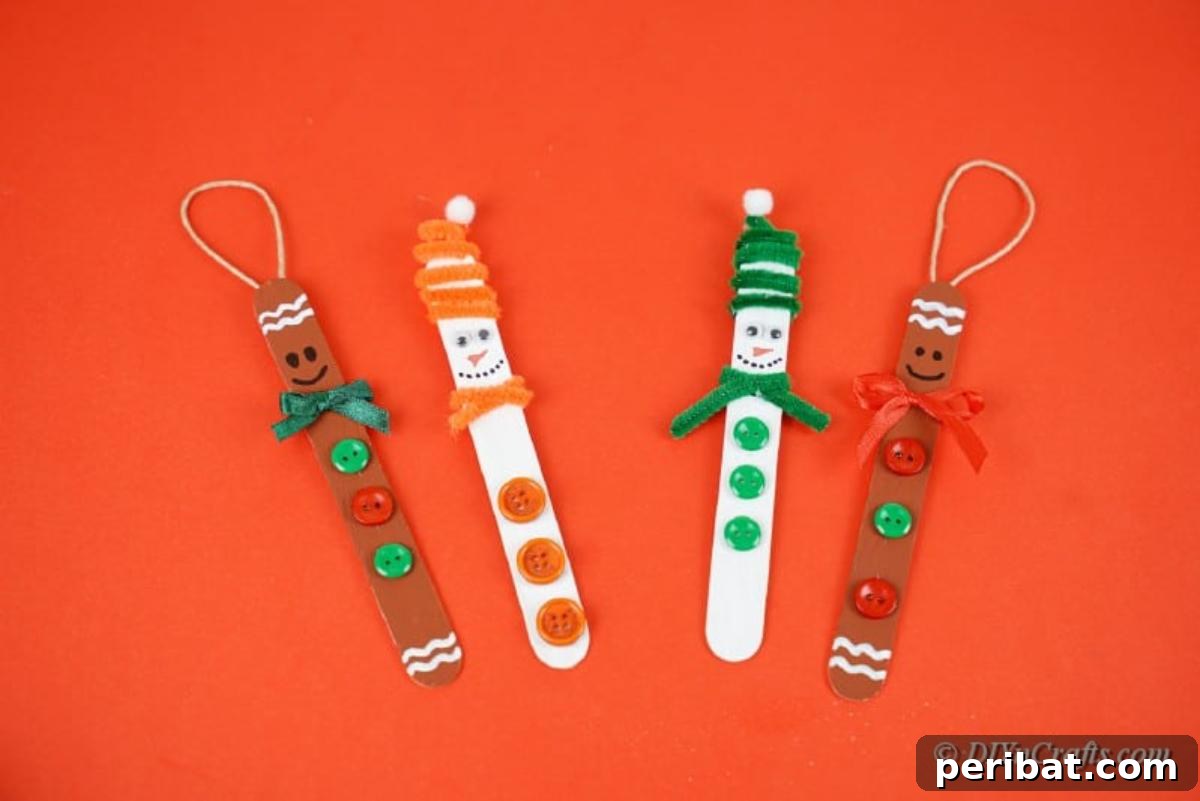 Sweet and Snowy Craft Stick Holiday Decor 15 A set of completed popsicle stick ornaments with hanging loops attached