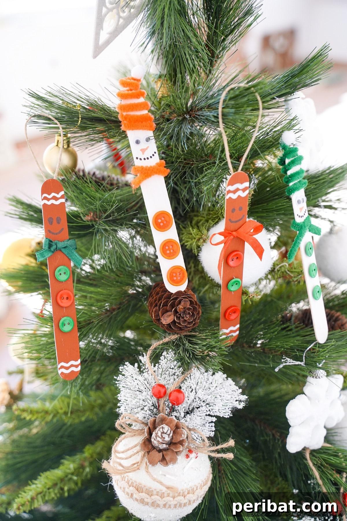 Sweet and Snowy Craft Stick Holiday Decor 26 Various craft stick ornaments hanging on a decorated Christmas tree