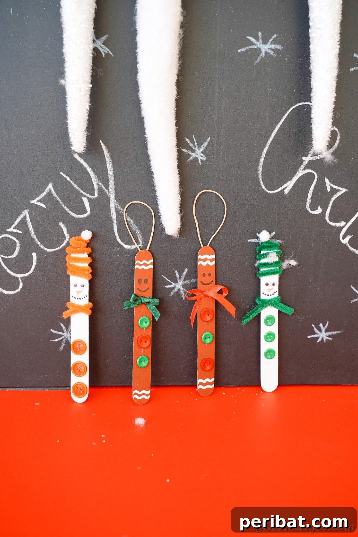 Sweet and Snowy Craft Stick Holiday Decor 29 Four craft stick ornaments, including snowmen and gingerbread men, displayed against a chalkboard background