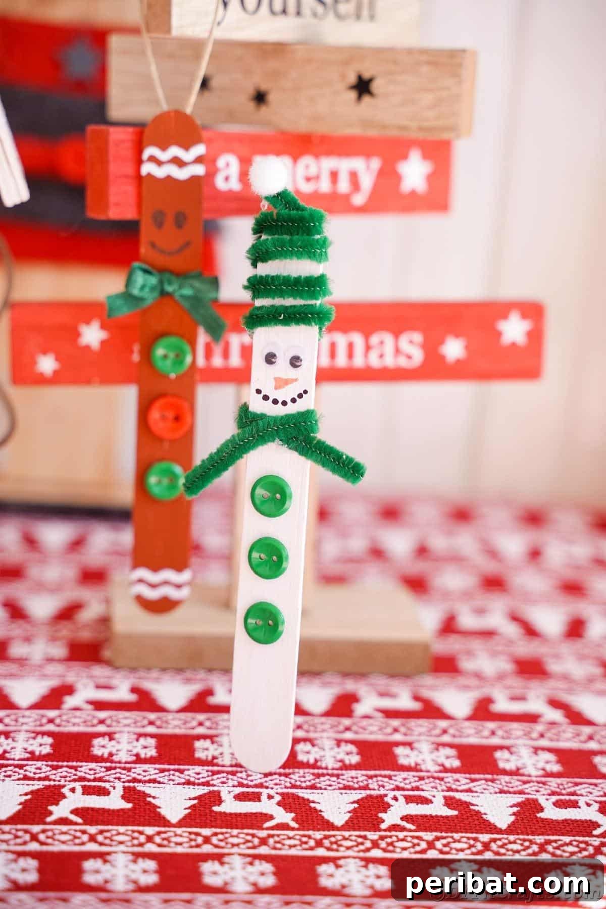 Sweet and Snowy Craft Stick Holiday Decor 6 Gingerbread man and snowman craft stick ornaments displayed in front of festive holiday decor
