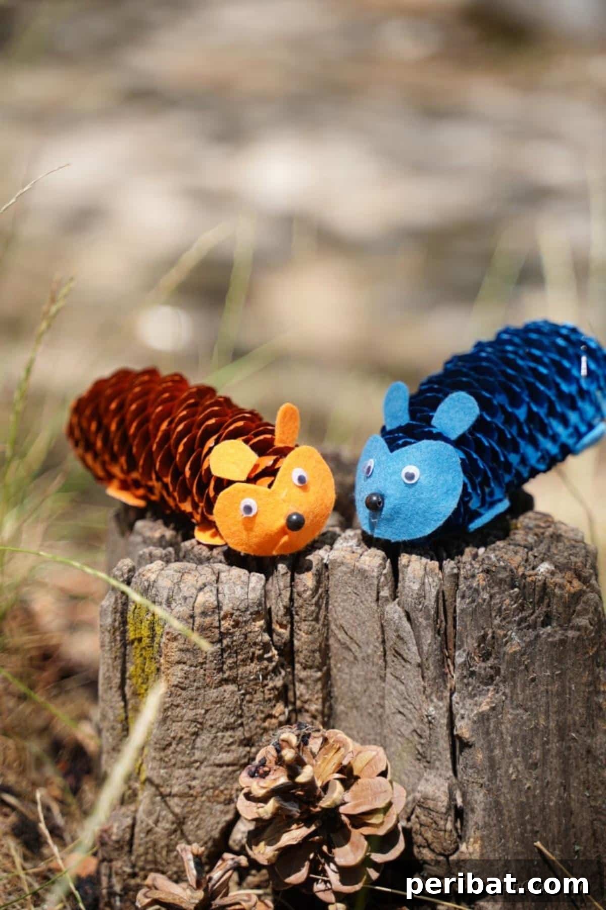 Whimsical Pinecone Hedgehogs 16 Two vibrant pinecone hedgehogs, one blue and one orange, resting on a weathered wooden stump, serving as charming fall decor.
