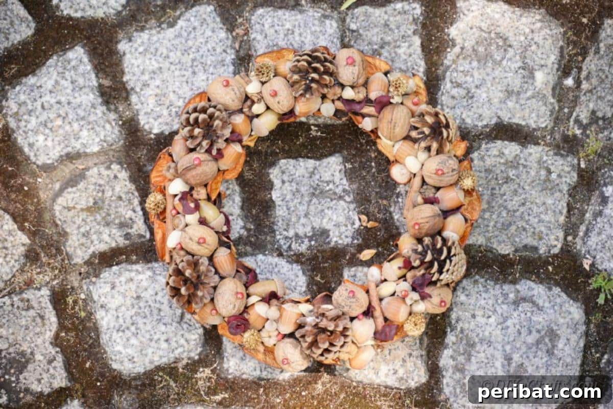 Foraged Fall Wreath 16 handmade wreath sitting over stone