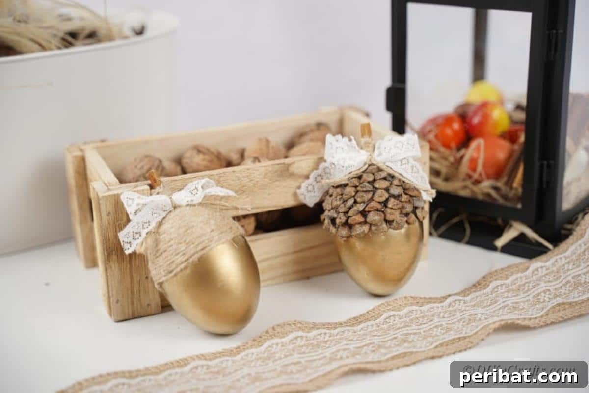Atık Plastik Yumurtalardan Sonbahar Meşe Palamudu Yapımı 3 Artfully arranged gold acorn crafts showcasing their elegant shimmer on display.