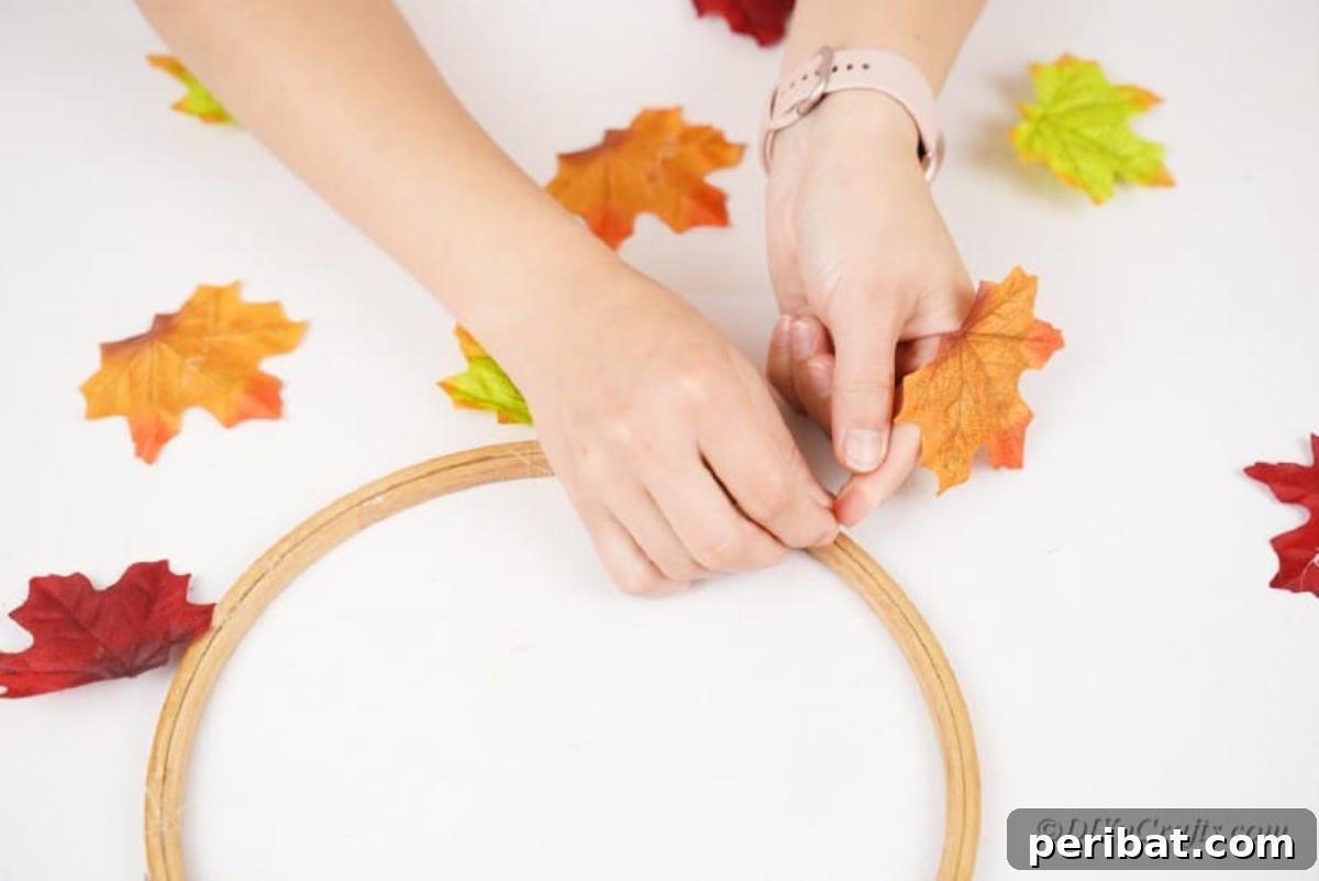 Vibrant Autumn Leaves Mobile 14 attatching strings to wooden craft hoop