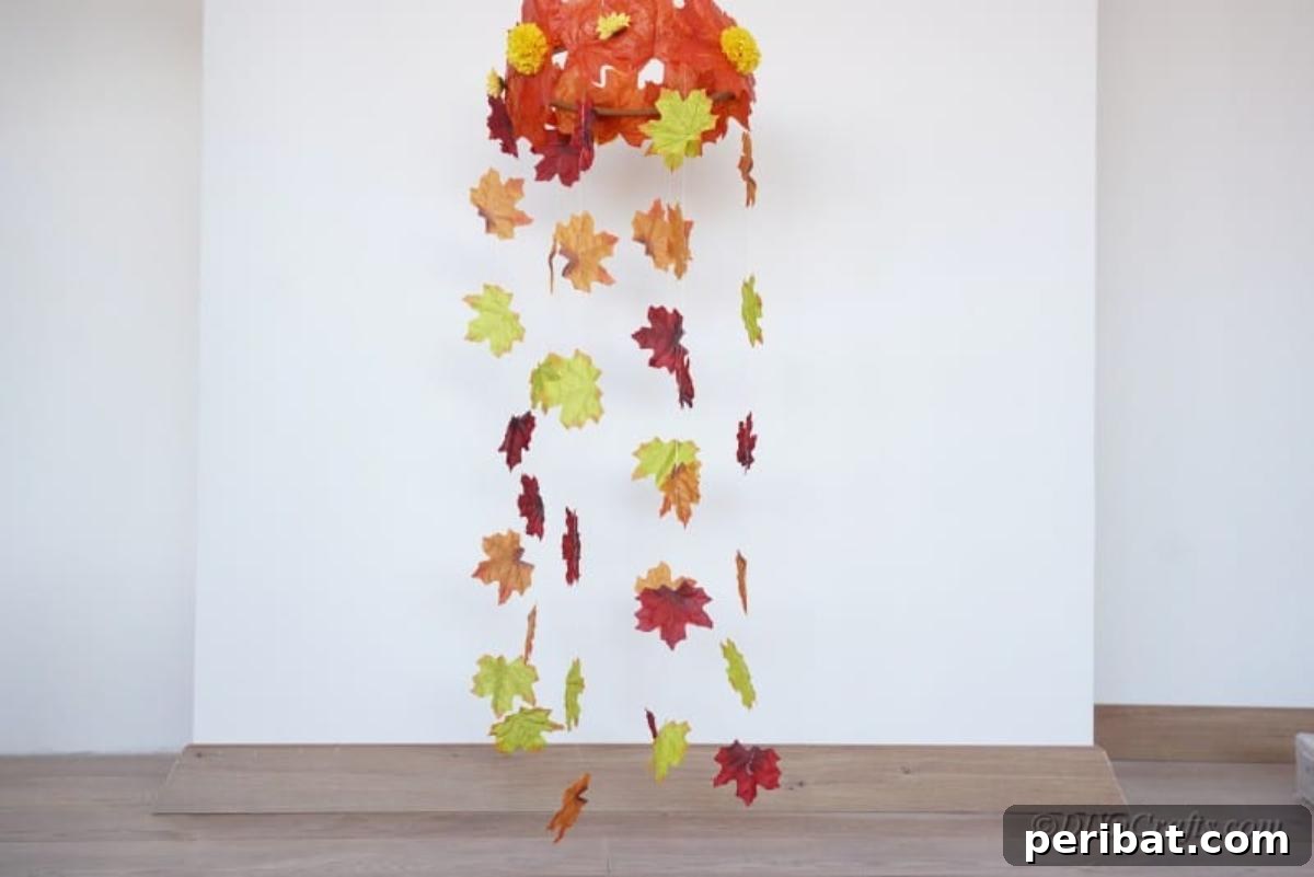 Vibrant Autumn Leaves Mobile 3 Fall leaf wind catcher hanging against white wall