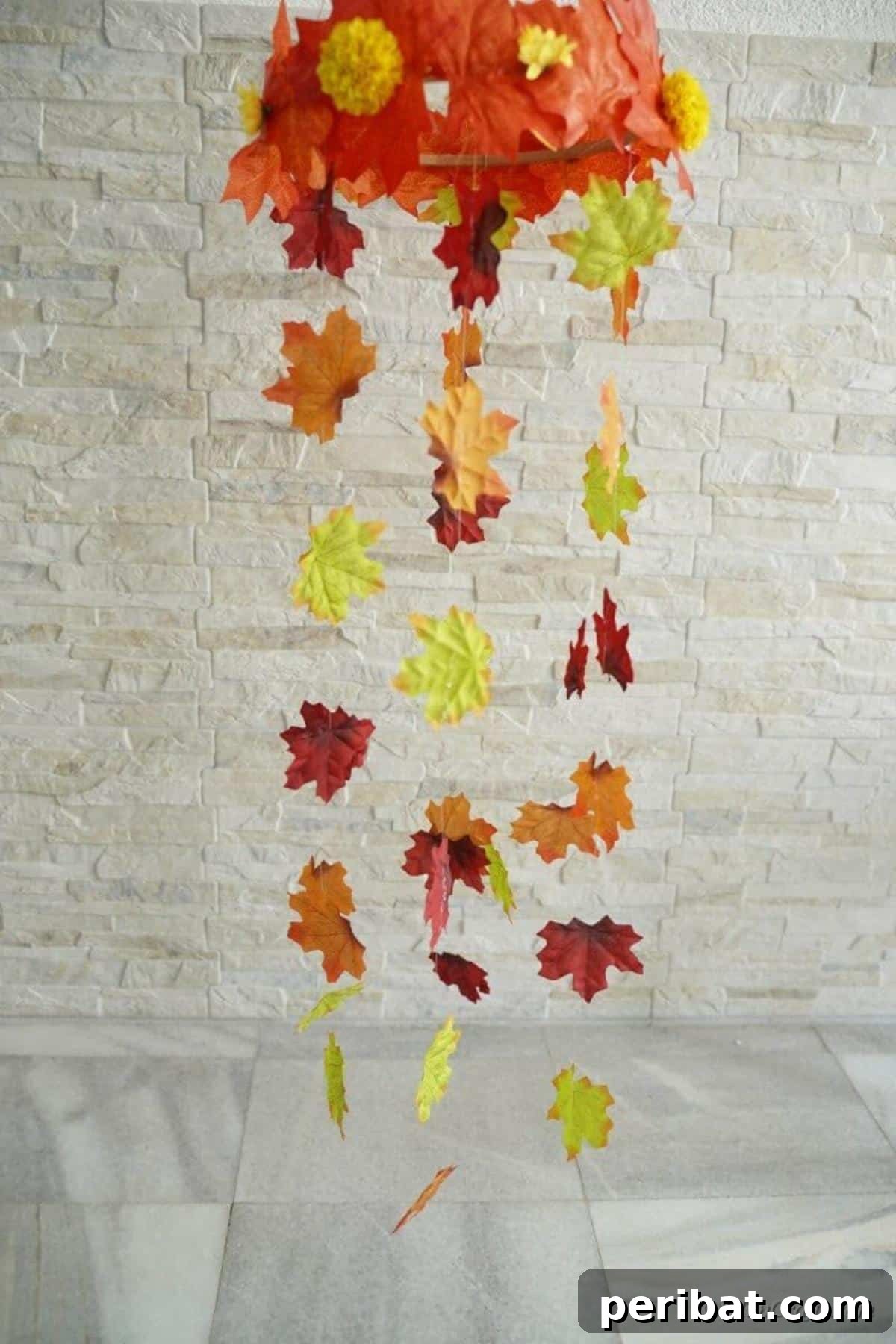 Vibrant Autumn Leaves Mobile 4 Brick wall behind fall leaf mobile