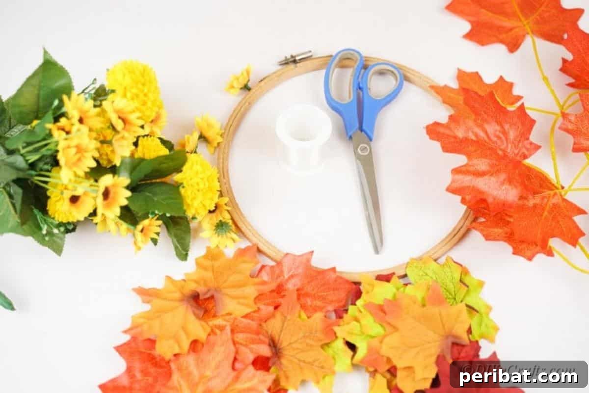Vibrant Autumn Leaves Mobile 6 Embroidery hoop and fake flowers on white table