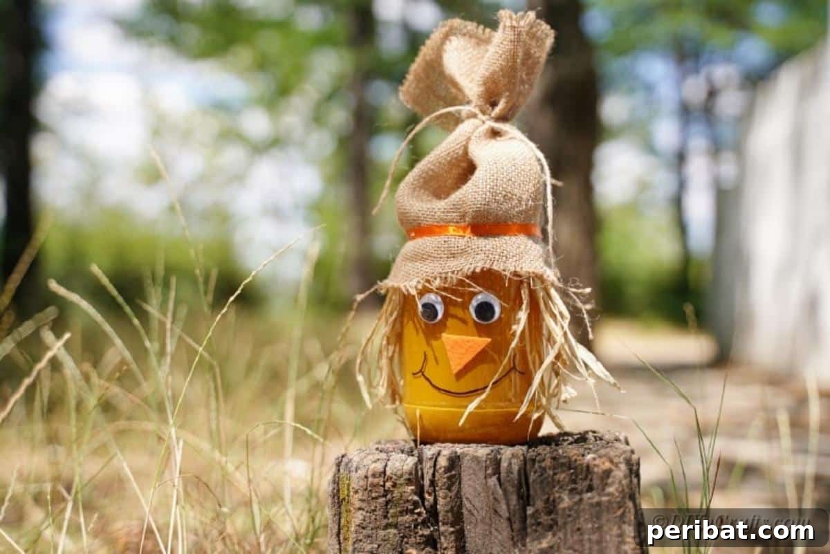 Whimsical Fall Scarecrow Jar Craft 18 A close-up shot of an orange-painted craft jar, showcasing its smooth finish and vibrant color, ready to be adorned as a scarecrow.