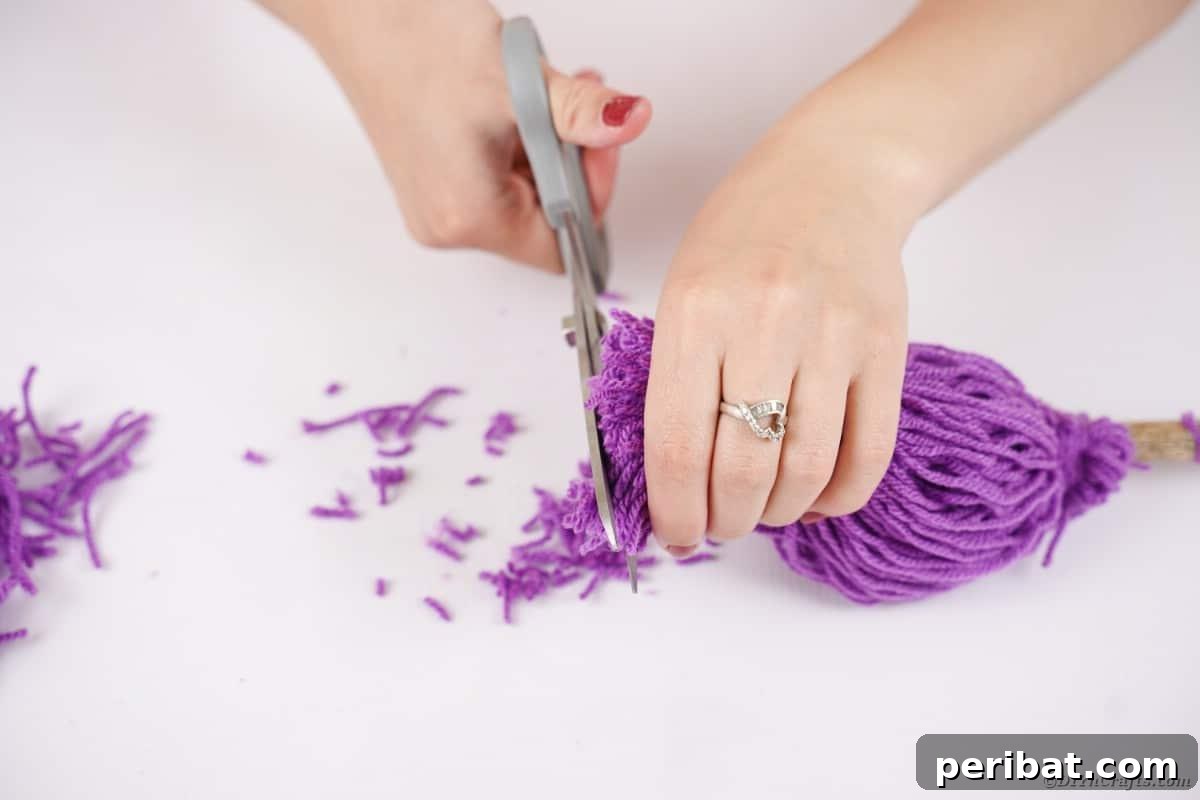 Bewitching DIY Broomstick Decor 13 Trimming yarn off end of broom
