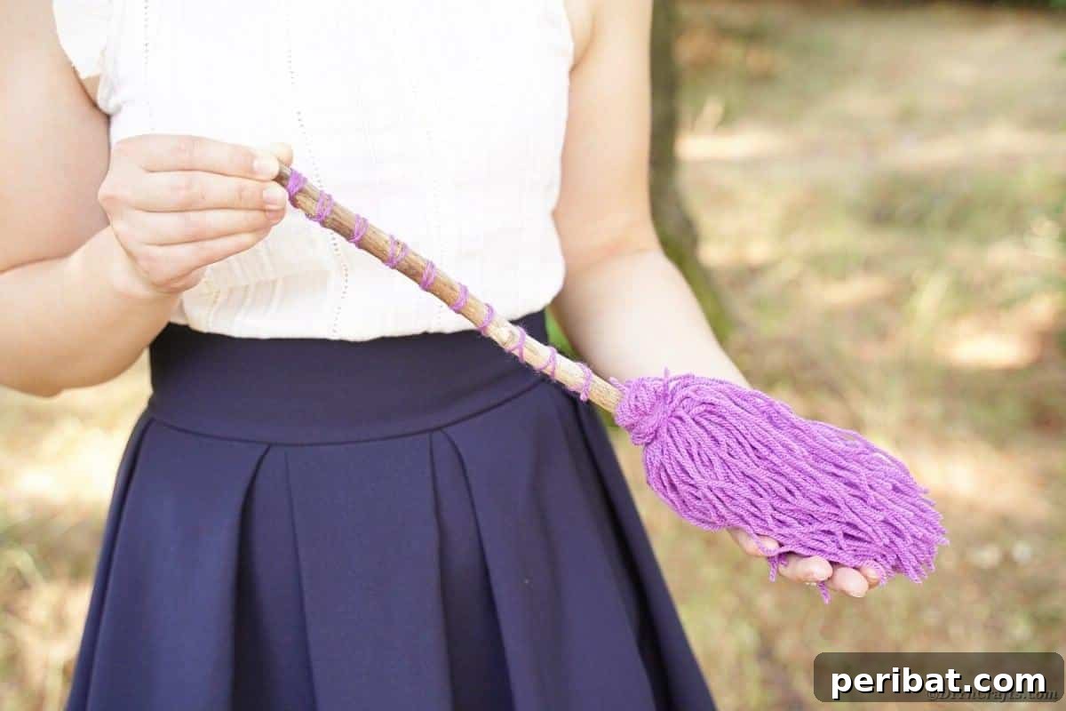 Bewitching DIY Broomstick Decor 6 Woman holding witch's broom
