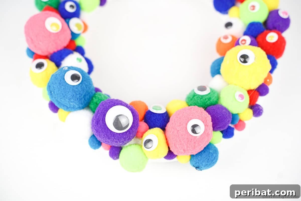 Creepy Cute Pom Pom Monster Wreath 13 Monster wreath on white surface