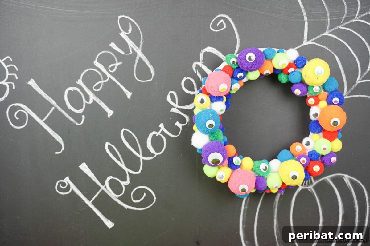 Creepy Cute Pom Pom Monster Wreath 3 Pom pom wreath on chalkboard
