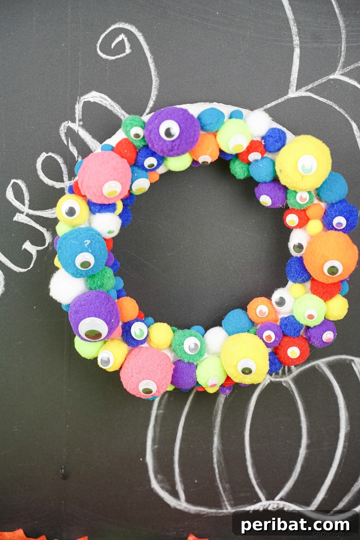 Creepy Cute Pom Pom Monster Wreath 15 Pom pom wreath on chalkboard
