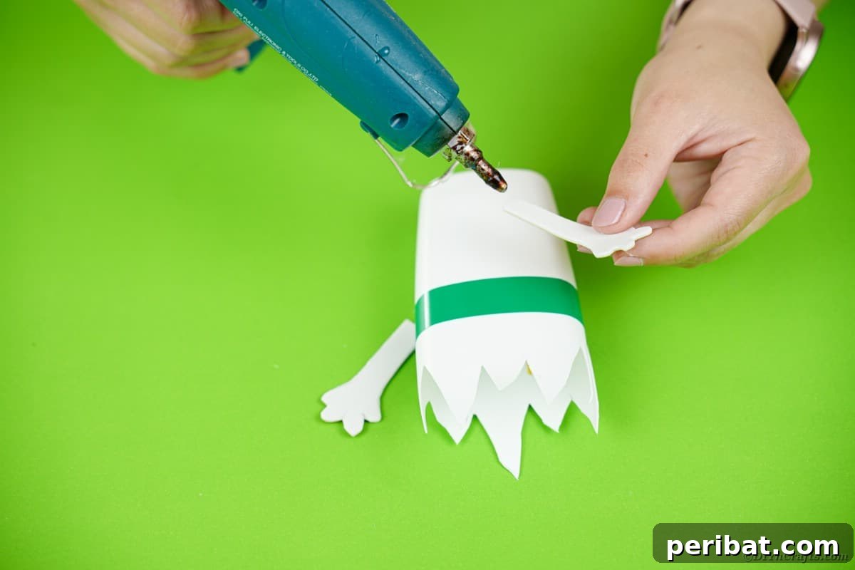 Gluing arms on monster bottle