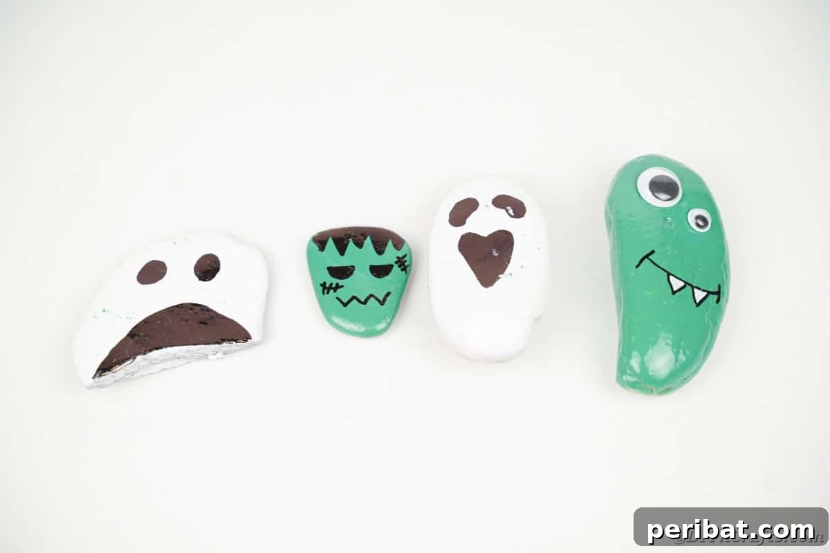 Spooky Sweet Halloween Rock Art 5 Painted rocks on white surface