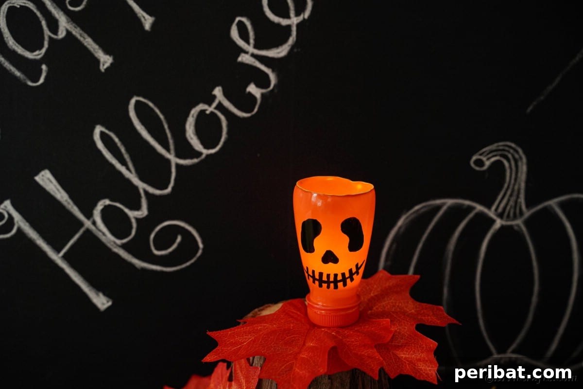 Charming Recycled Bottle Jack O Lantern 3 Pumpkin lantern placed elegantly next to a rustic chalkboard
