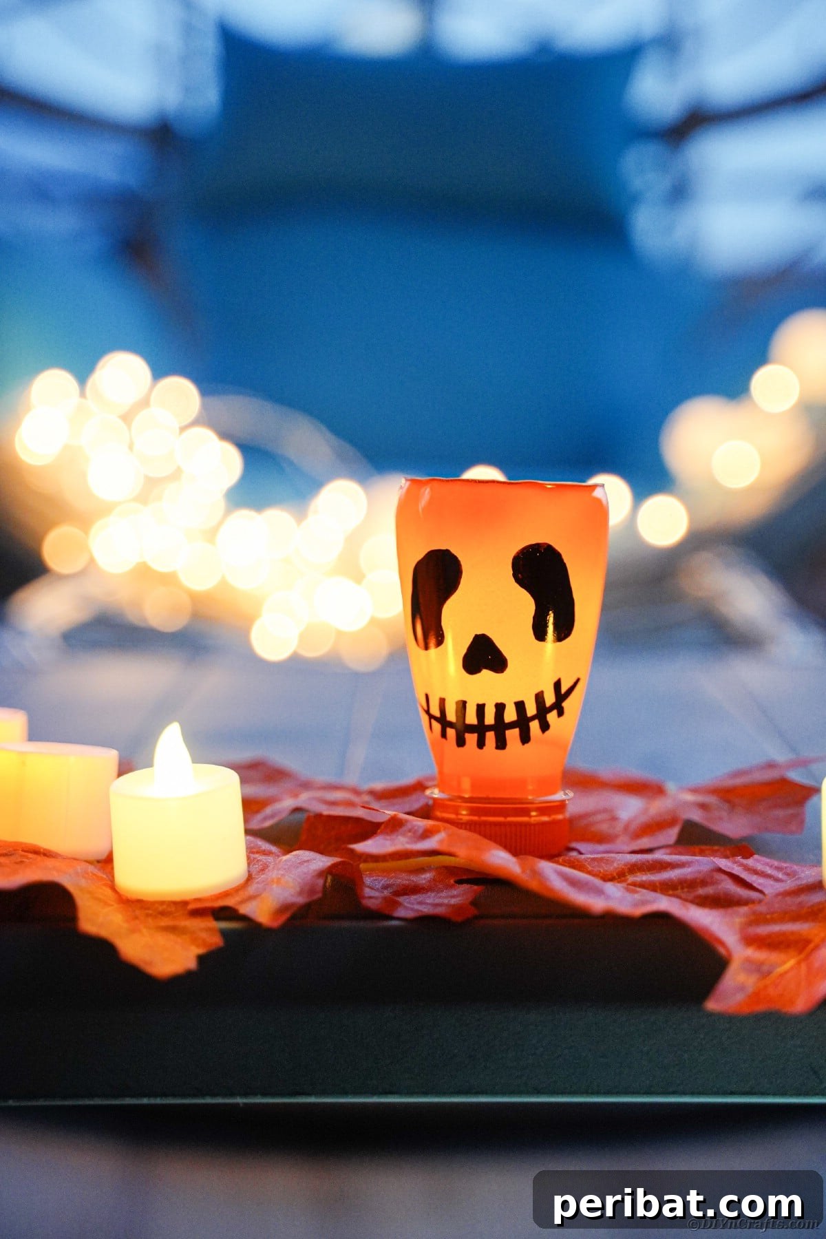 Charming Recycled Bottle Jack O Lantern 14 A collection of pumpkin lanterns and autumn leaves bathed in soft light
