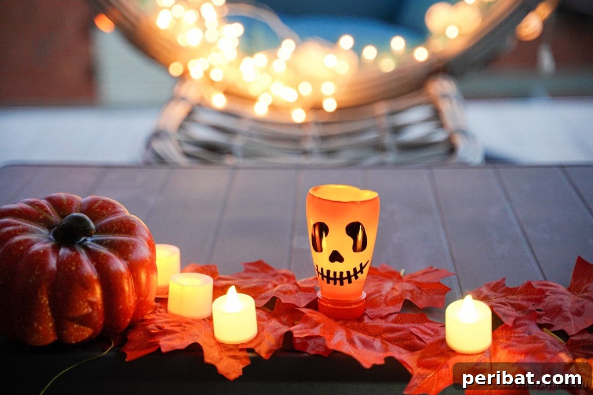 Charming Recycled Bottle Jack O Lantern 5 Several pumpkin lanterns on autumn leaves, illuminated by warm candlelight