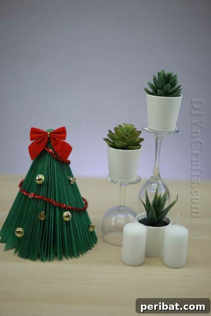 40+ Adorable Mini Christmas Tree Decor Ideas 11 Creative upcycled old book transformed into a green Christmas tree with tiny ornaments, perfect for a cozy centerpiece.