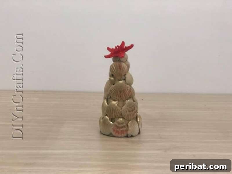 40+ Adorable Mini Christmas Tree Decor Ideas 15 Unique miniature seashell Christmas tree, painted with gold or silver, suitable for a beach-themed or rustic holiday decor.