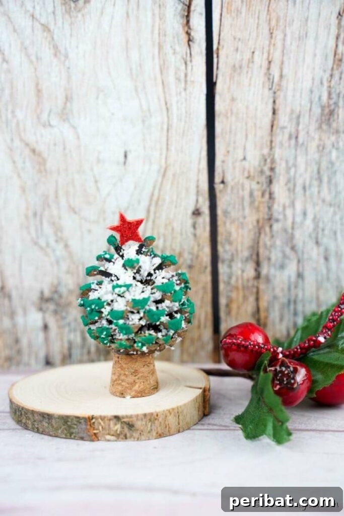 40+ Adorable Mini Christmas Tree Decor Ideas 3 Rustic pinecone Christmas tree standing on a wooden slice, ideal for natural holiday decor.