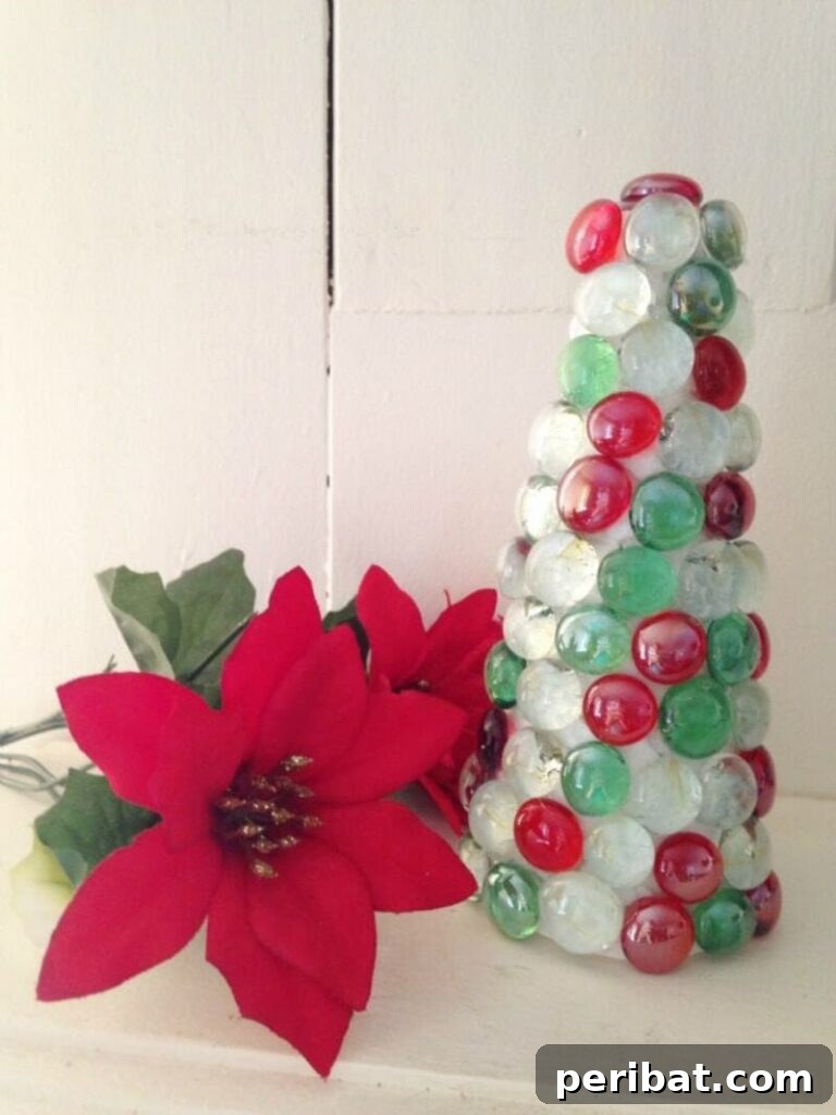 40+ Adorable Mini Christmas Tree Decor Ideas 27 Vibrant dollar store DIY jewel Christmas tree, a budget-friendly and sparkling centerpiece for holiday decor.