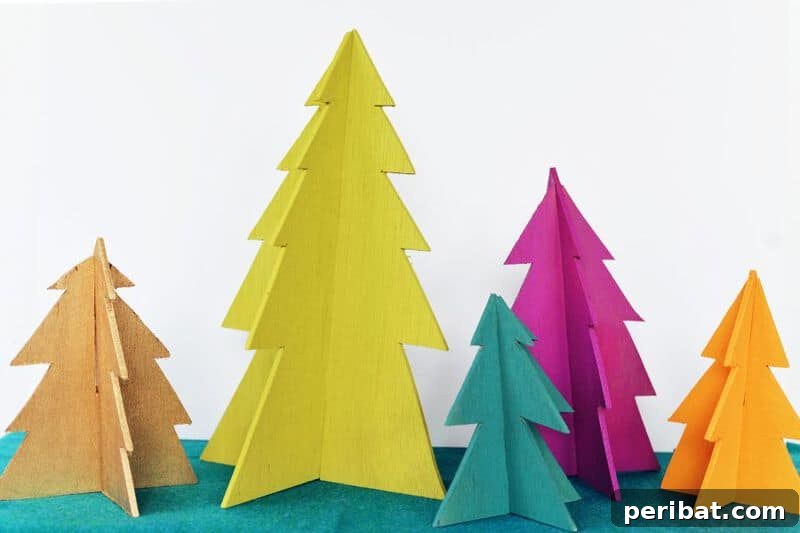 40+ Adorable Mini Christmas Tree Decor Ideas 31 Colorful assortment of DIY wooden Christmas trees, customizable with paint for unique home decor.