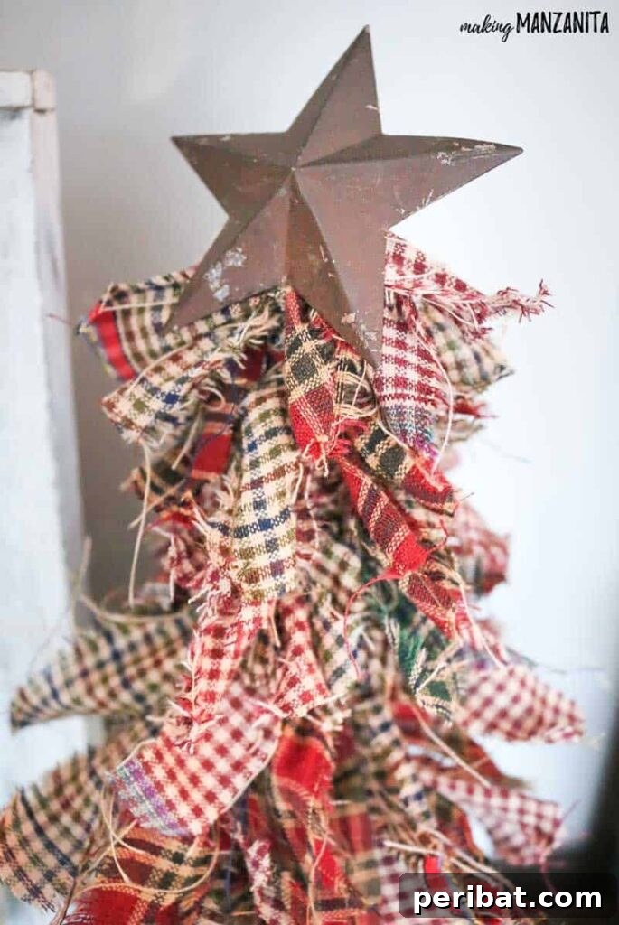 40+ Adorable Mini Christmas Tree Decor Ideas 35 Charming primitive fabric Christmas tree crafted with homespun fabric, ideal for old-fashioned and rustic decor.