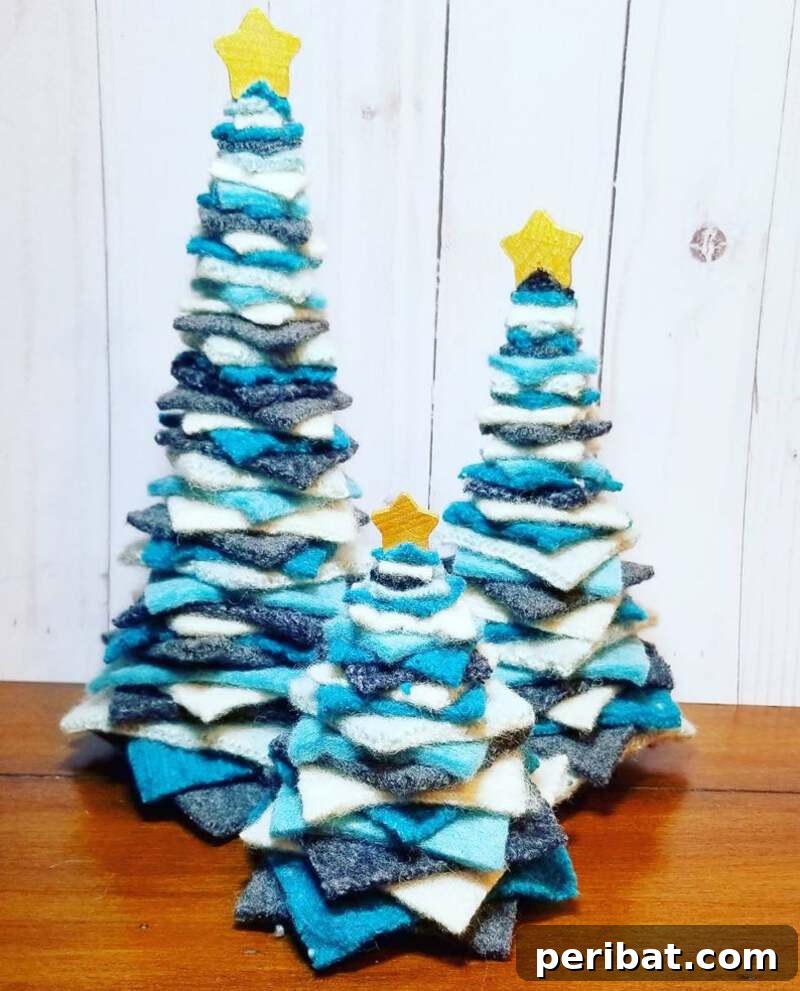 40+ Adorable Mini Christmas Tree Decor Ideas 40 Stylish blue felt strip Christmas tree, featuring layered felt to create a thick branch look, customizable in various colors.
