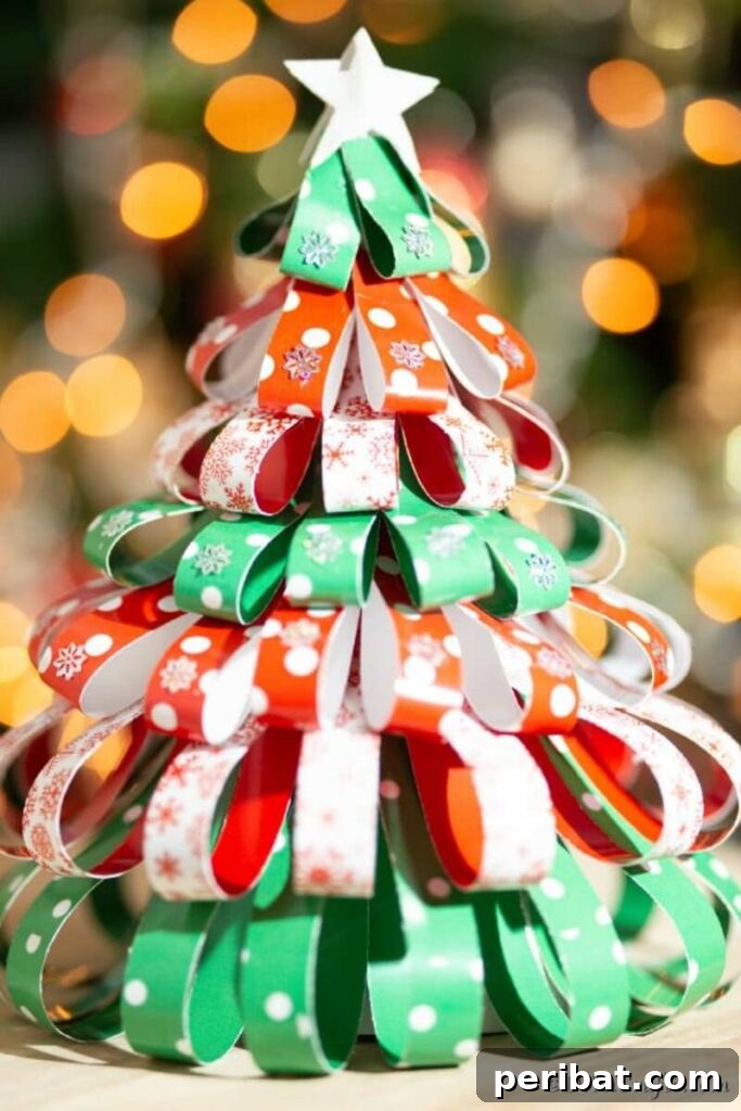 40+ Adorable Mini Christmas Tree Decor Ideas 6 Colorful paper strip Christmas tree, a fun and easy DIY decoration for the holiday season.