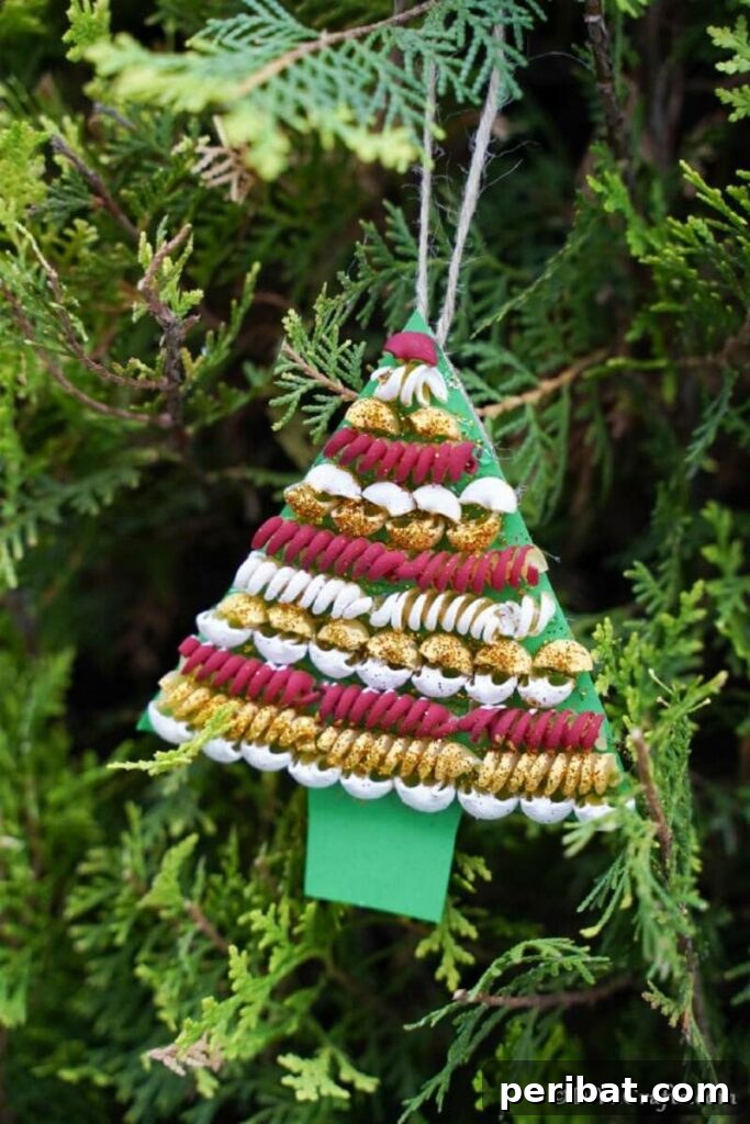 40+ Adorable Mini Christmas Tree Decor Ideas 9 A creative pasta Christmas tree decoration, perfect as a kid-friendly craft project for holiday fun.