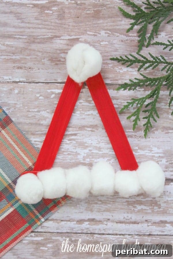 Delightful Christmas Popsicle Stick Creations for Kids 13 Festive Santa Claus Hat Craft Made from Craft Sticks