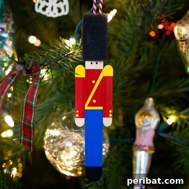Delightful Christmas Popsicle Stick Creations for Kids 18 Handmade Toy Soldier Ornament Displayed on a Christmas Tree