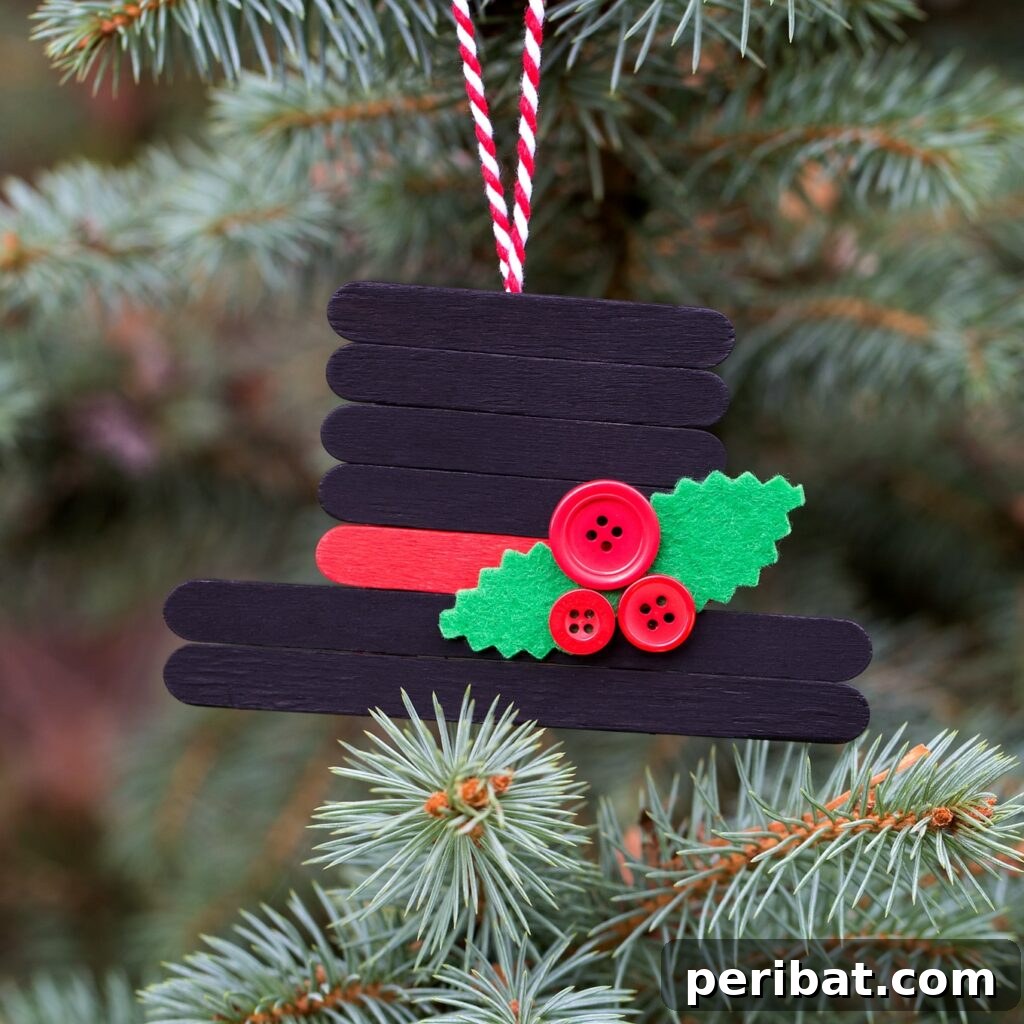 Delightful Christmas Popsicle Stick Creations for Kids 19 Adorable Craft Stick Snowman Hat Ornament Hanging in a Christmas Tree