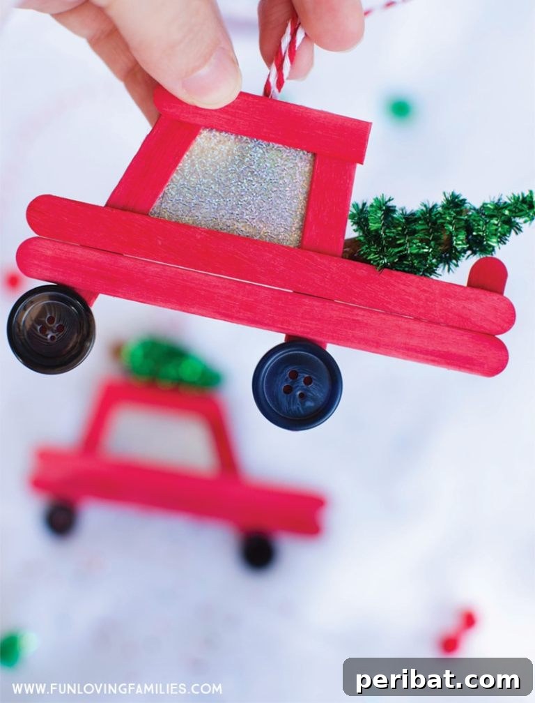 Delightful Christmas Popsicle Stick Creations for Kids 21 Woman Holding a Handmade Craft Stick Red Truck Christmas Ornament