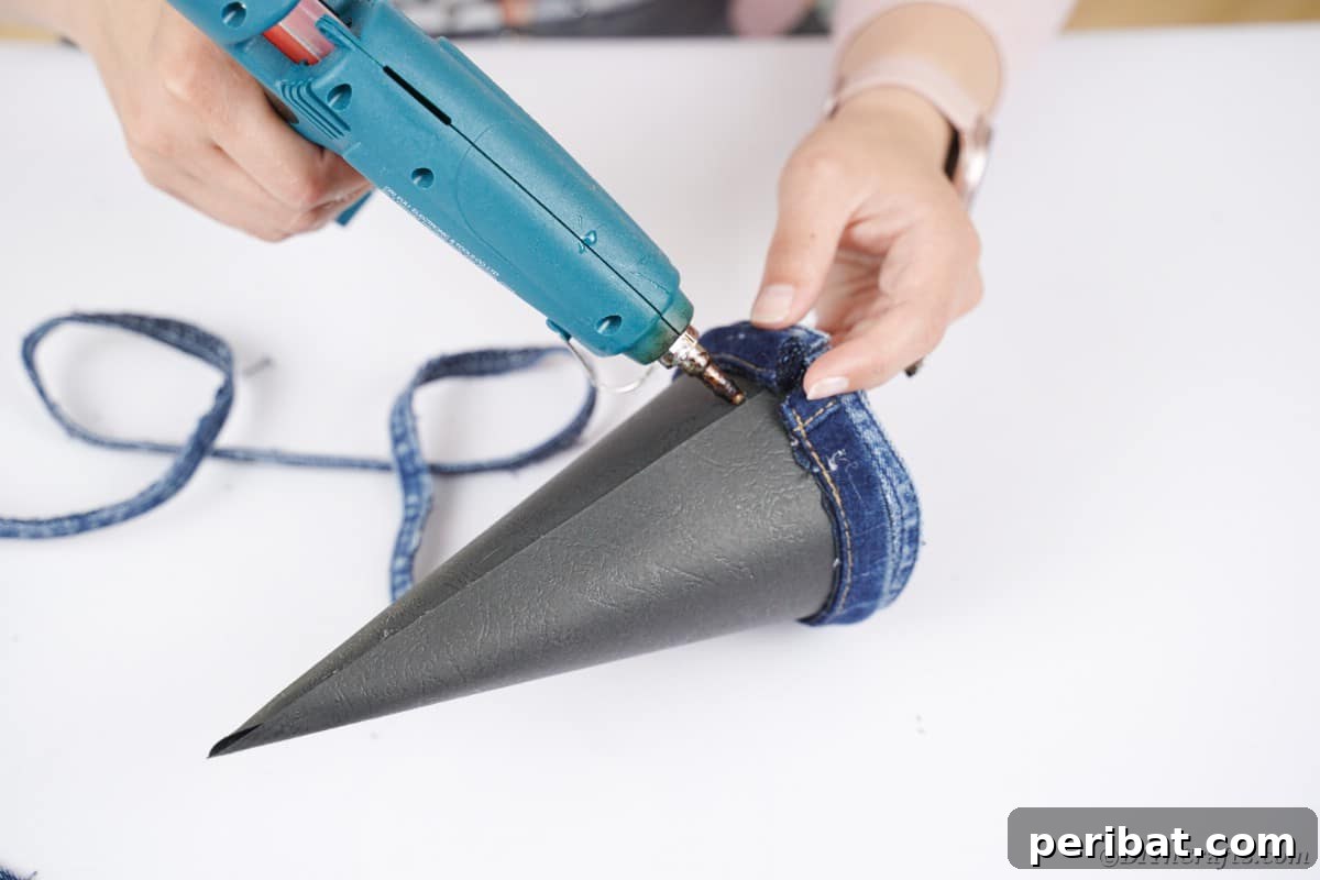 Upcycled Denim Mini Christmas Tree 13 Gluing denim to cone