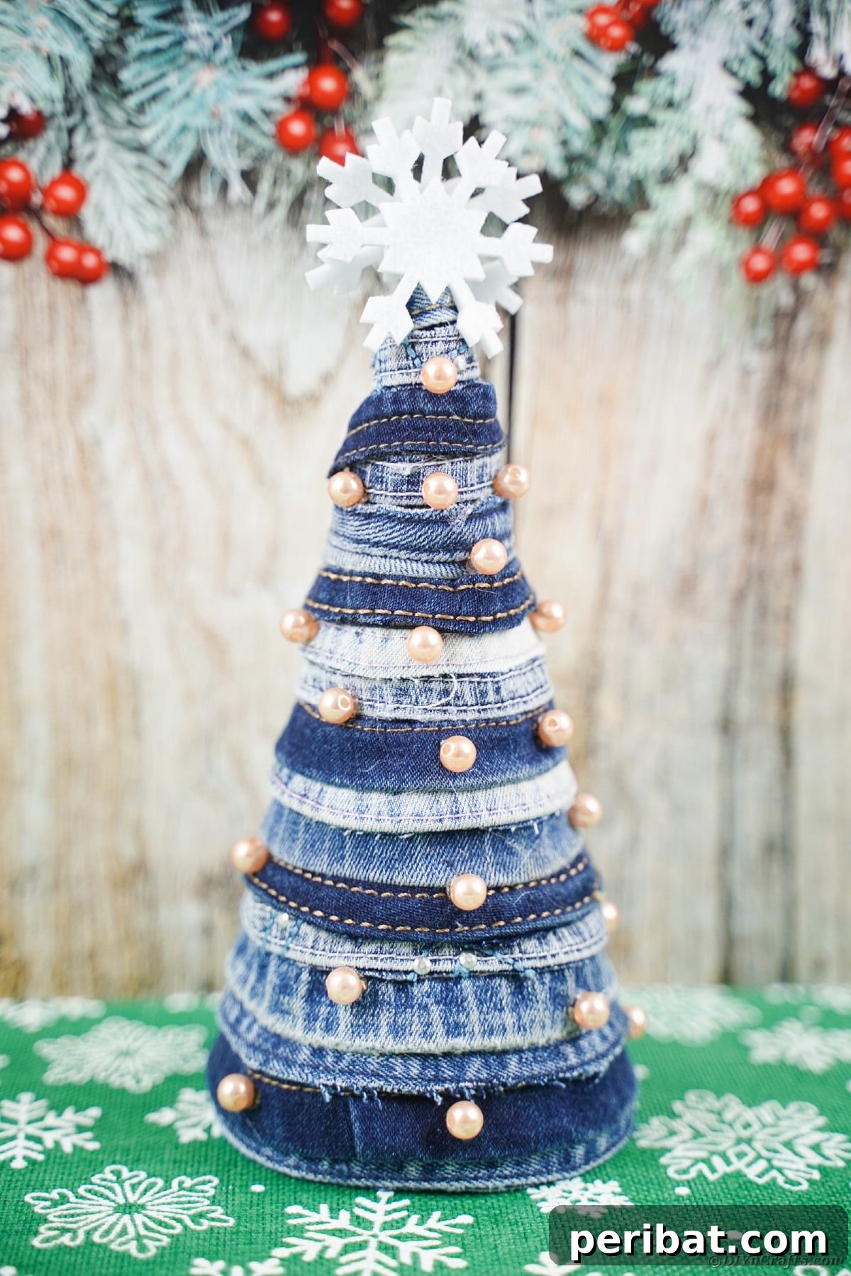 Upcycled Denim Mini Christmas Tree 18 Mini blue jean tree in front of wood