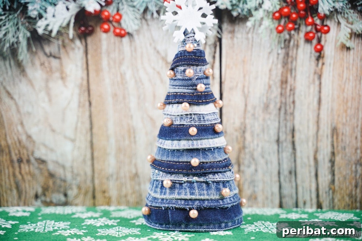 Upcycled Denim Mini Christmas Tree 4 Mini blue jean tree in front of wood