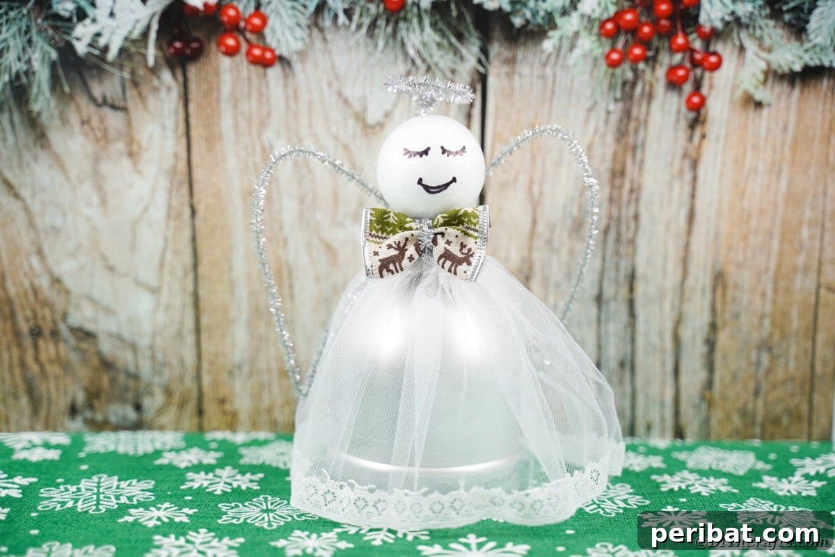 Enchanting Upcycled Bottle Angel Ornament 3 Bottle angel against boards, showcasing the elegant simplicity of upcycled Christmas crafts.