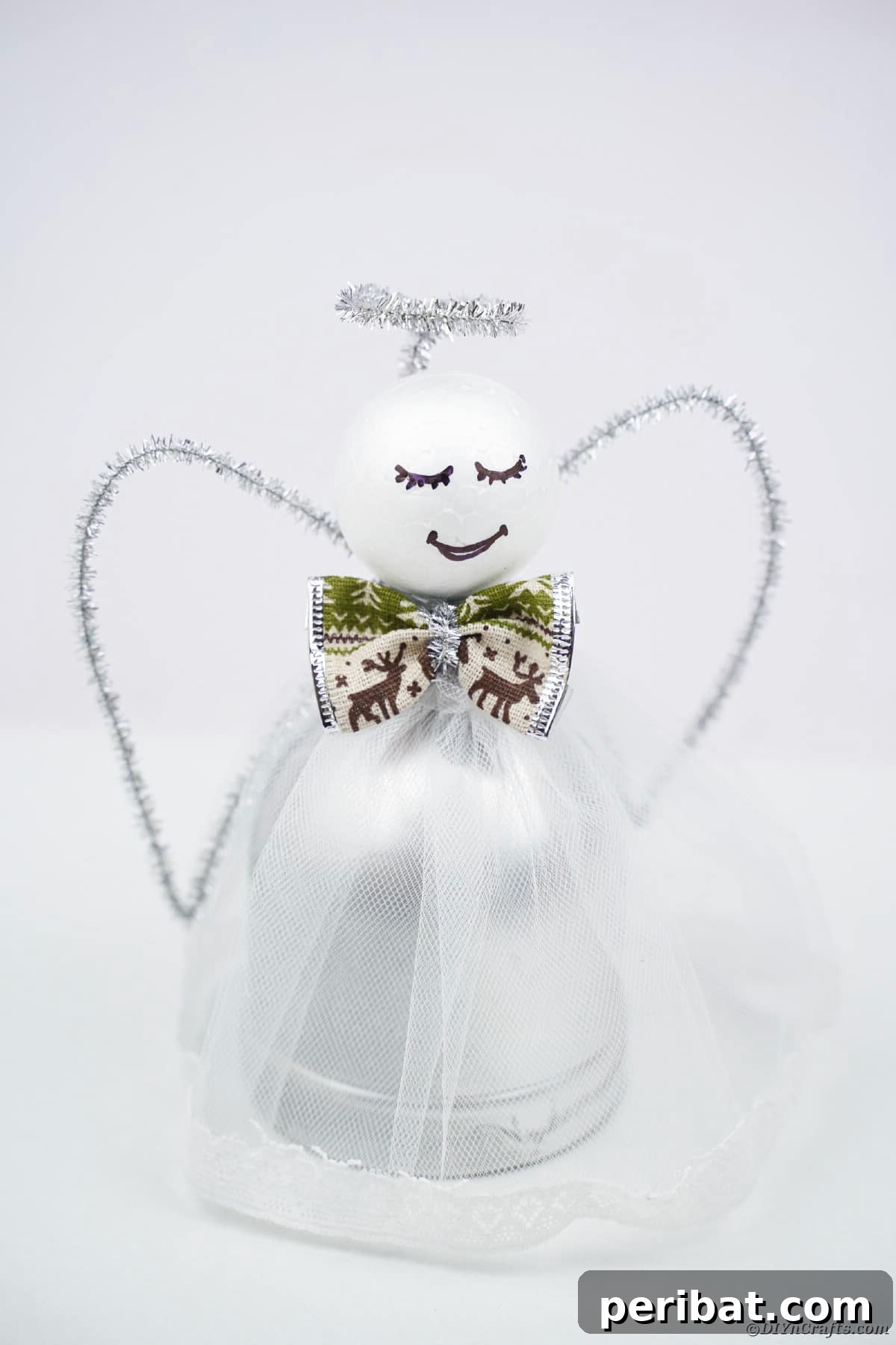 Enchanting Upcycled Bottle Angel Ornament 13 Angel on white background, highlighting a glittery upcycled bottle angel for Christmas.
