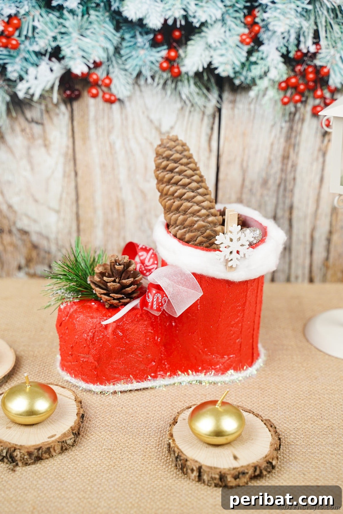 A handmade Santa boot displayed on a wooden table, ready for holiday cheer.