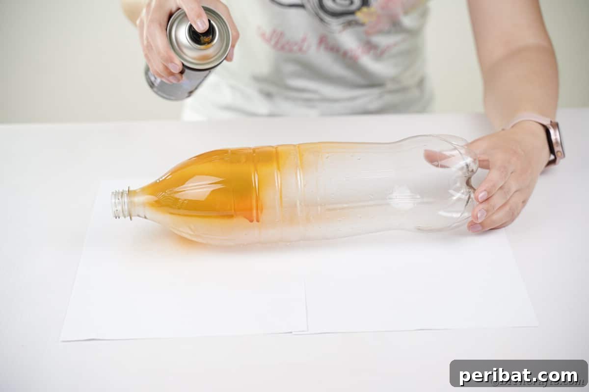 Charming Upcycled Pinecone Hedgehog Art 9 Spraying the plastic bottle orange, preparing the base for the pinecone hedgehog