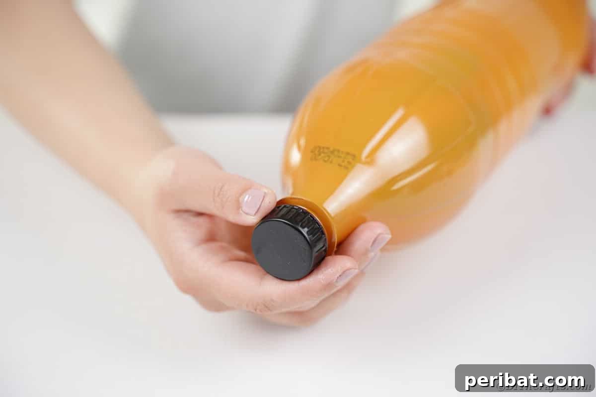Charming Upcycled Pinecone Hedgehog Art 10 Screwing the cap back onto the painted bottle, forming the hedgehog's face