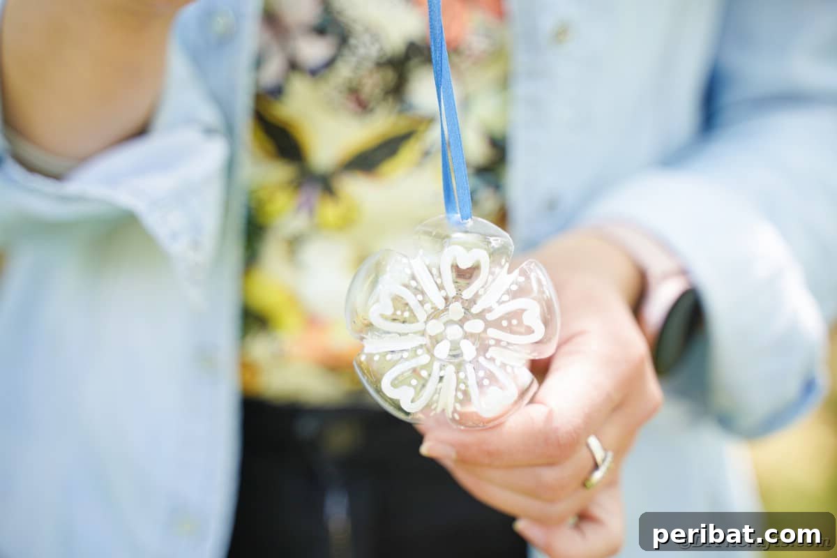 Bottle to Bauble: Stunning Upcycled Snowflakes 3 Snowflake ornament in hand