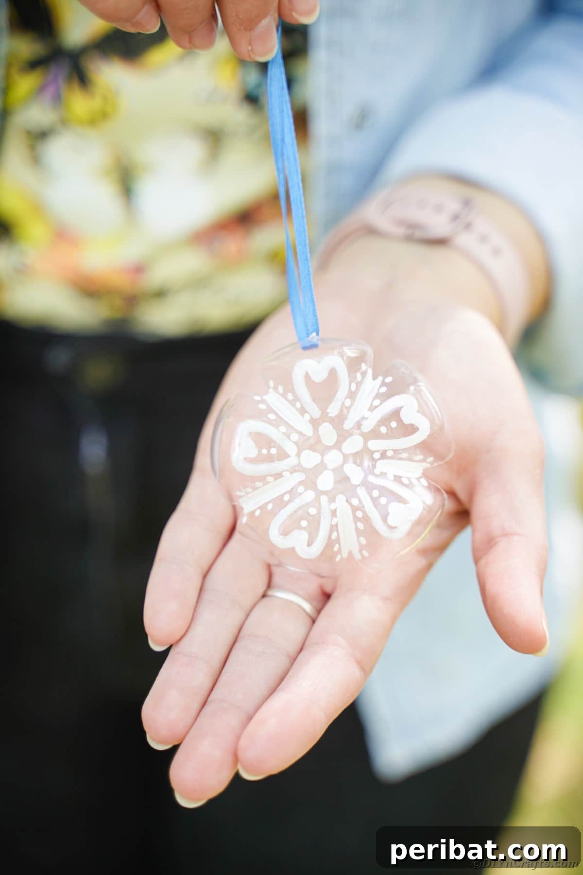 Bottle to Bauble: Stunning Upcycled Snowflakes 17 Snowflake ornament in hand