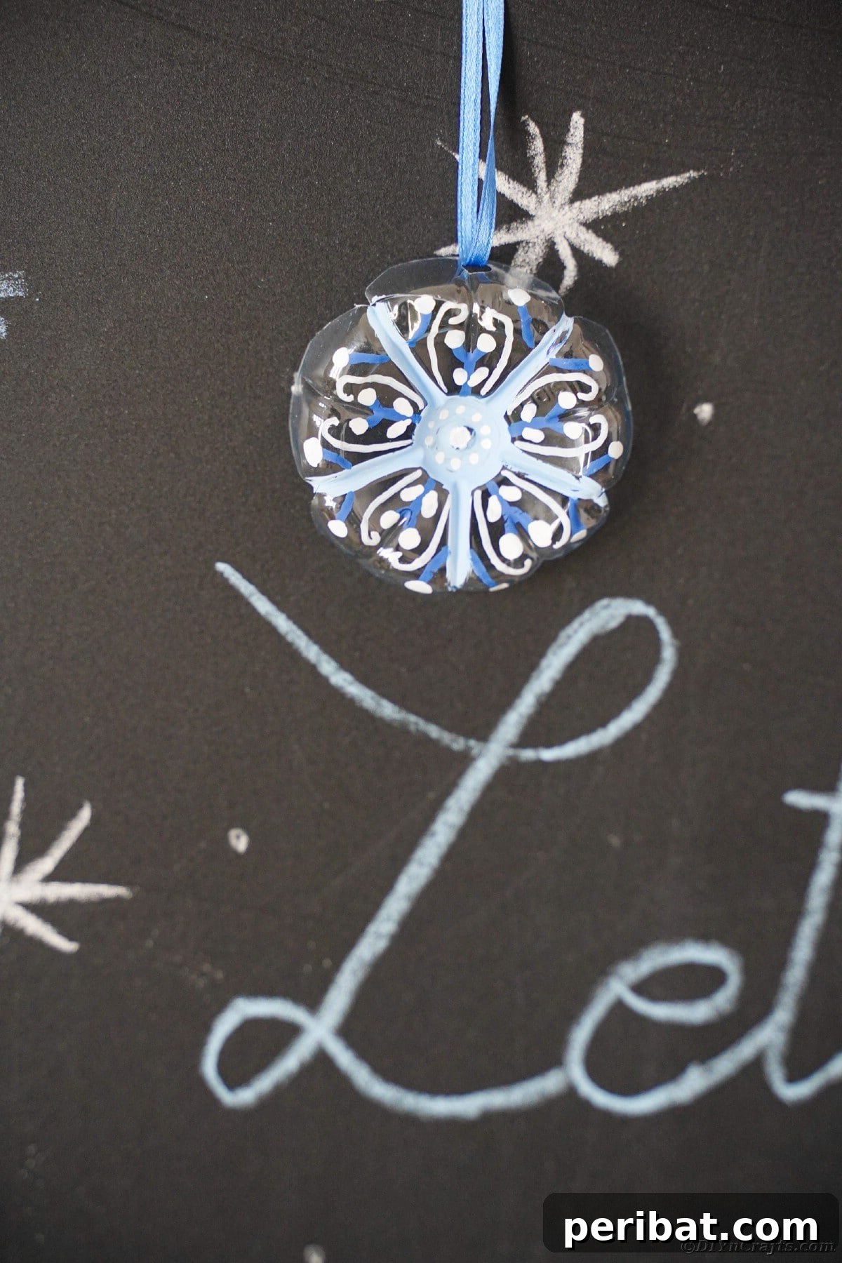 Bottle to Bauble: Stunning Upcycled Snowflakes 19 Snowflake ornaments on chalkboard