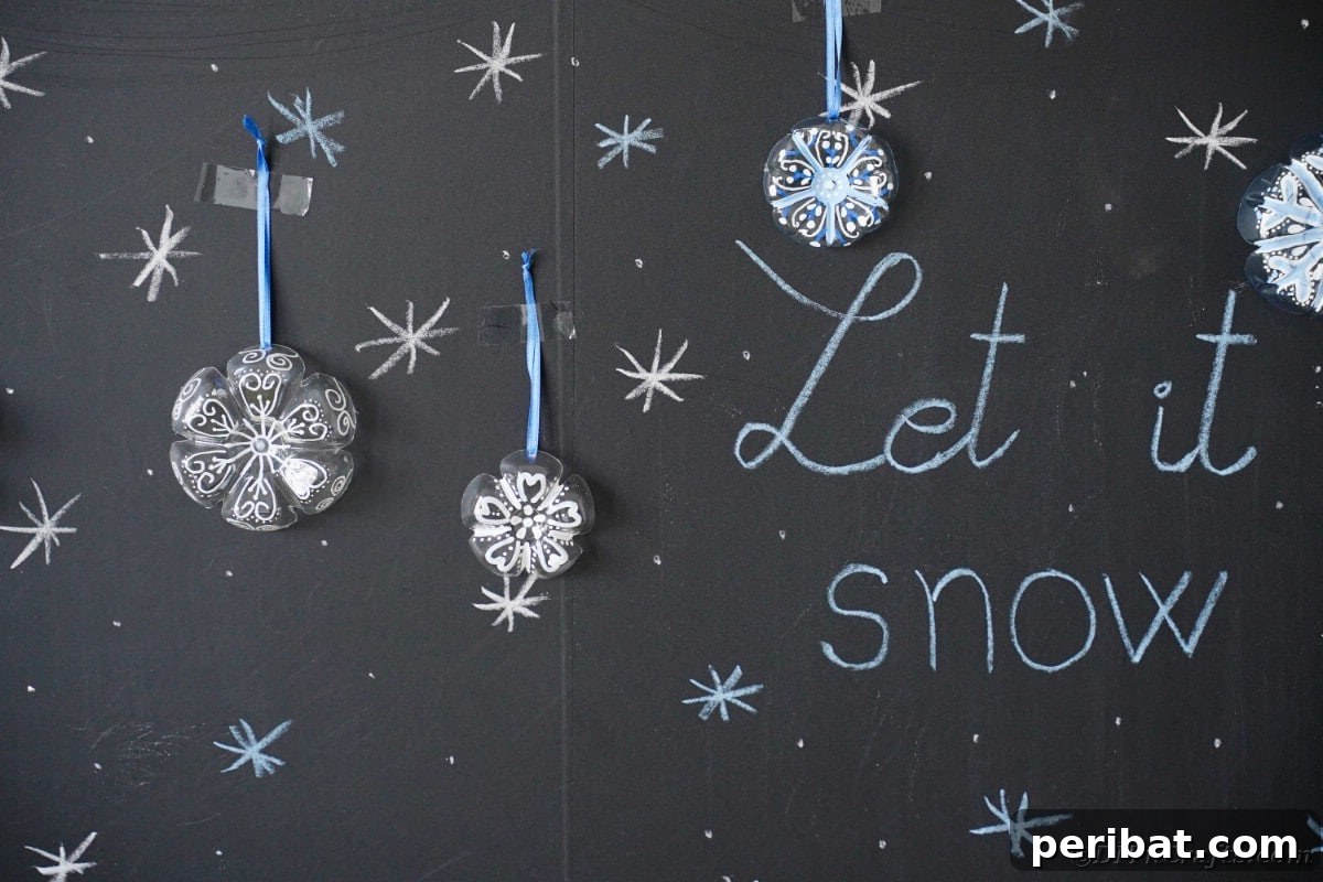 Bottle to Bauble: Stunning Upcycled Snowflakes 5 Snowflake ornaments on chalkboard