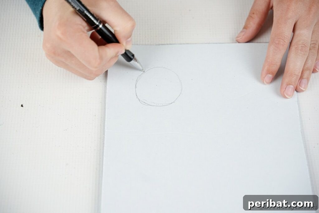 DIY Painted Tin Can Snowman Video Tutorial 14 Two concentric circles traced on a piece of foam paper, outlining the shape for the brim of the snowman's hat.